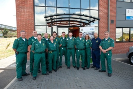 responders posing a large group photo outside.jpeg