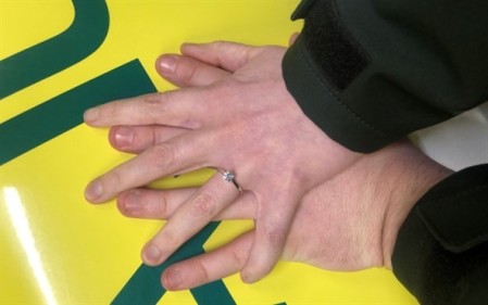 Their hands onto of one another, showing the ring.jpeg