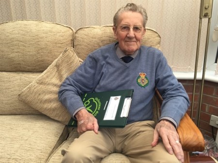 Tony with paperwork folder for his role as volunteer car driver