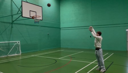 Jack Taylor throws a basketball to the net.