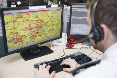 man looking at a map on a computer