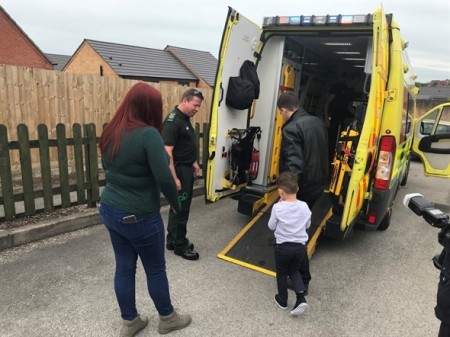 Sebastian being shown into the ambulance.