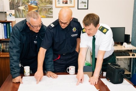 community responders pointing at the plan.jpeg