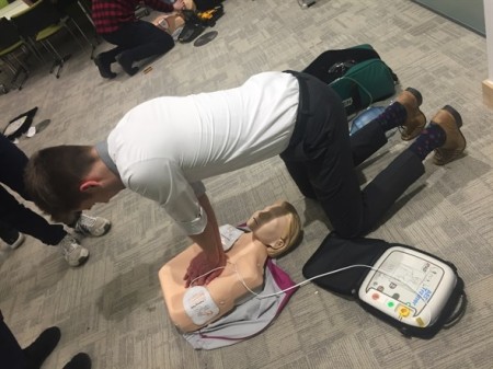 student giving compressions to a dummy.jpeg