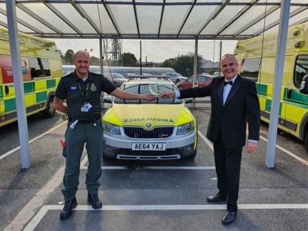 Roger Linnell stood in front of an ambulance .jpeg